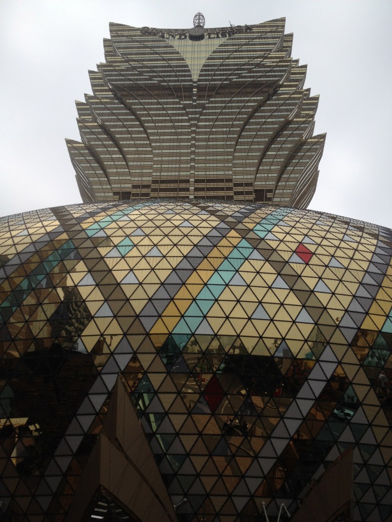 Front facade of the Grand Lisboa, which reflect the surrounding similar to The Bean in Chicago