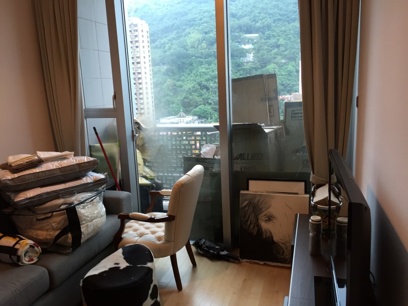 Unpacked status: the TV area. (Note all the cardboard on the balcony.)