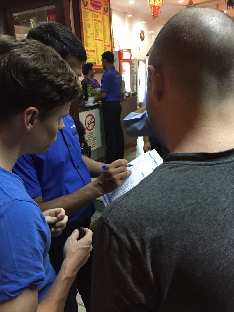 Braden and Daren deciding what to order. You make your decision before you're seated for maximum efficiency.